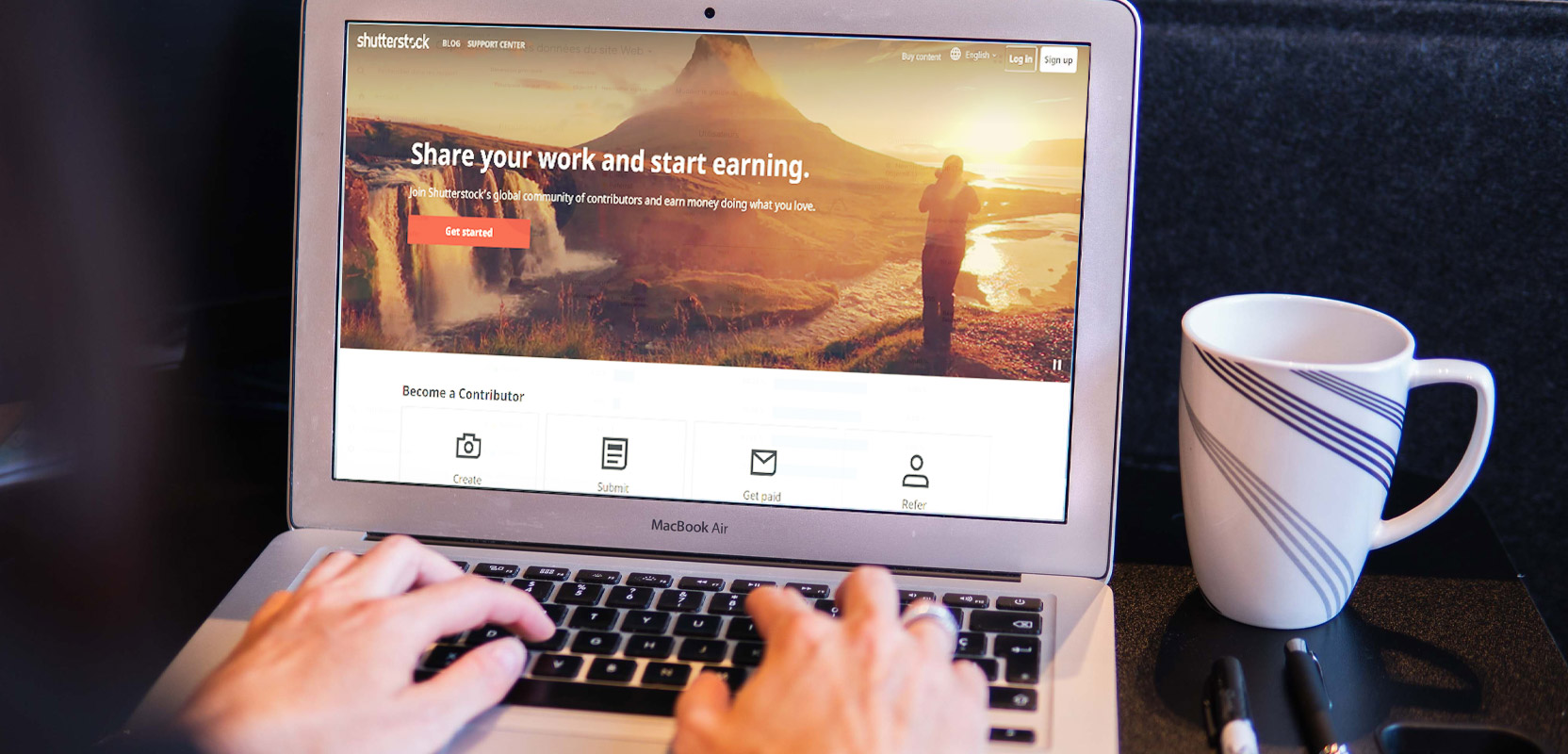 Laptop screen showing a stock photo website