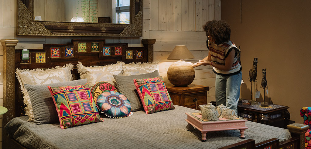 a woman is selling her furniture