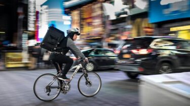 Bicycle courier delivering food for their side hustle.