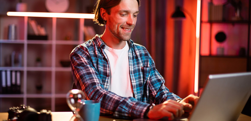 Freelancer working on their laptop and writing a review