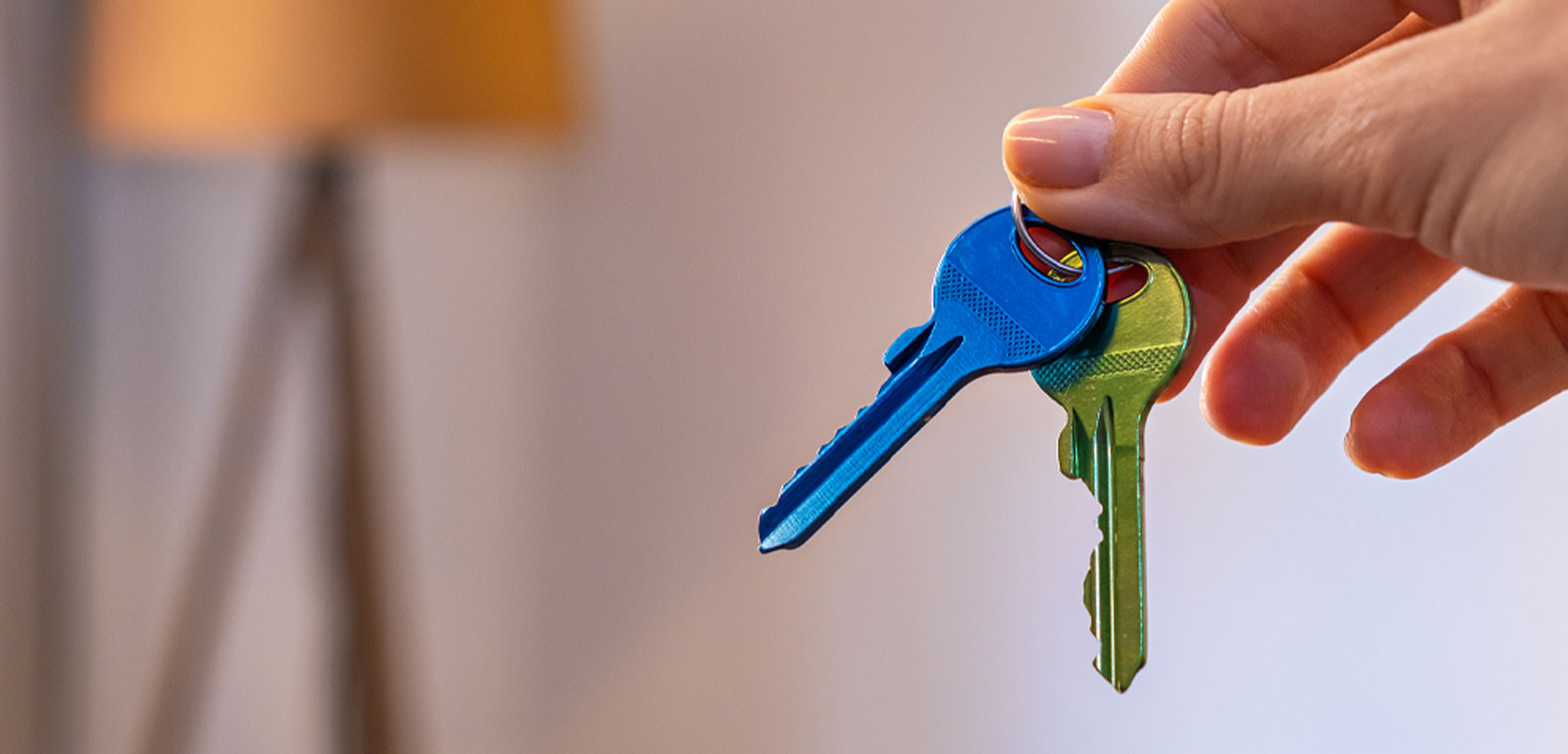 Pair of house keys representing renting a spare room as a side hustle for seniors