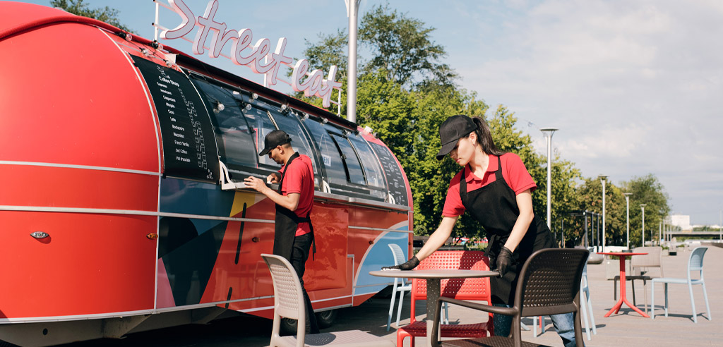 Couple setting up a food truck as a side hustle