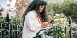 Woman taking a survey on her phone that offers an instant payout.