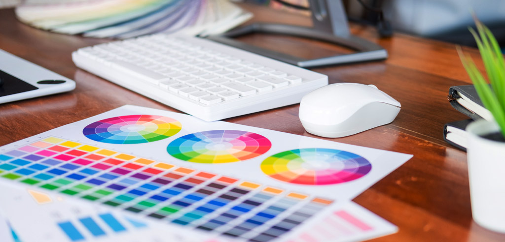 Sheet of paper with color wheels for reference in a graphic design side hustle