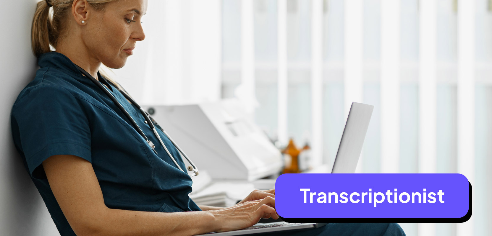 Nurse sitting at a laptop working as a freelance medical transcriptionist