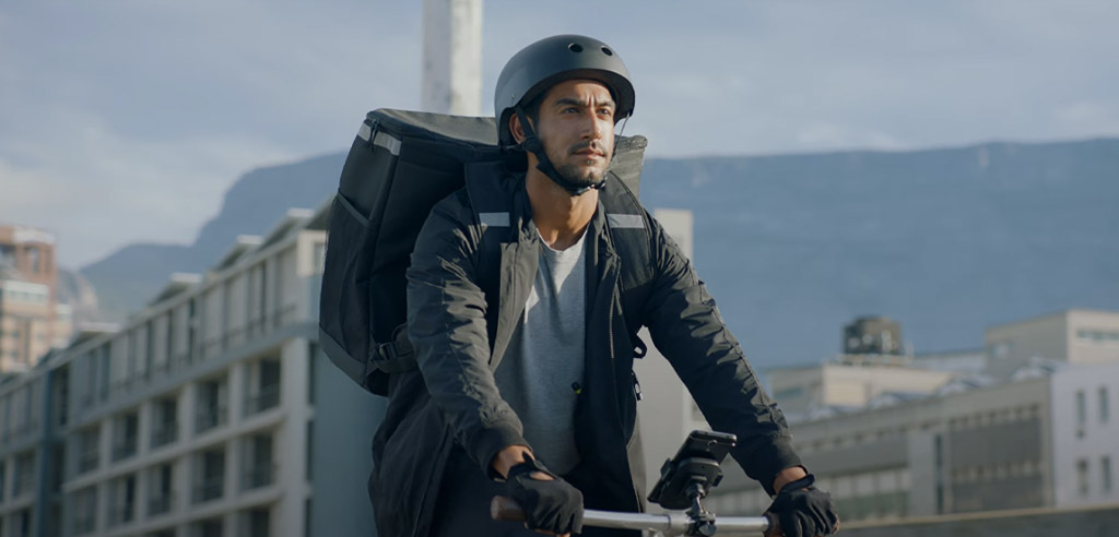 Uber Eats driver on a bike riding through the city