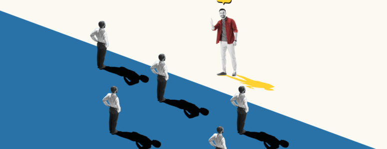 Man wearing a brightly colored shirt standing in front of several people in grayscale representing a unique side hustle