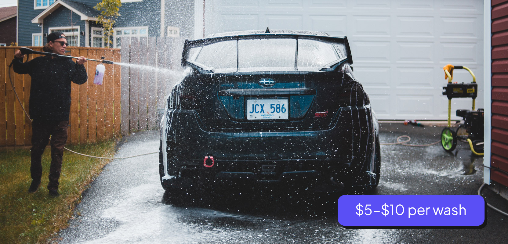Man washing a car as part of his side hustle