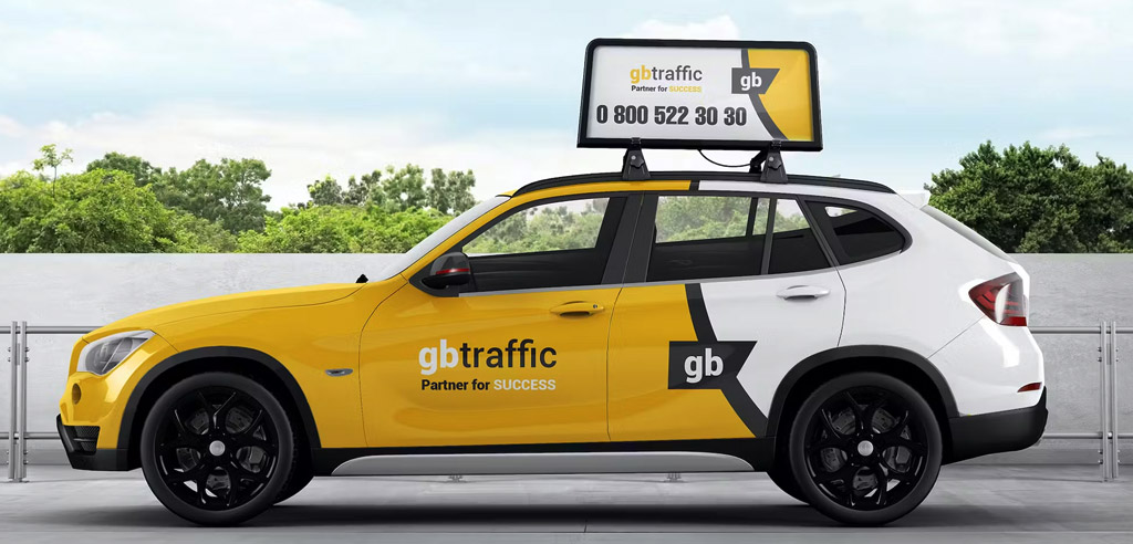 Car with an advertisement wrapped on it parked in a lot