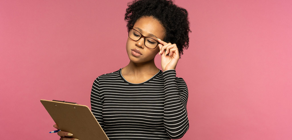 Female teacher looking at a clipboard