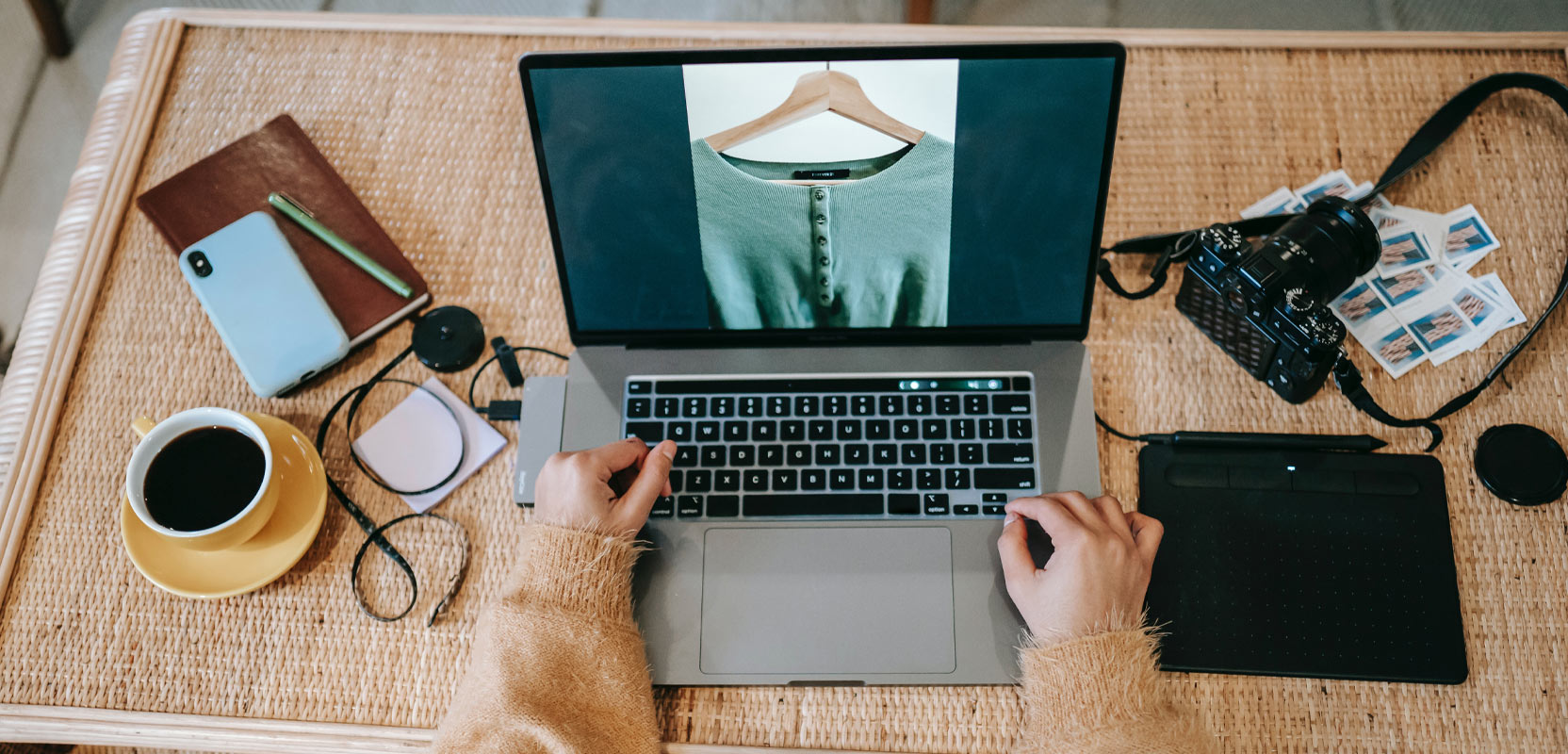 Photographer editing pictures on their laptop for their side hustle